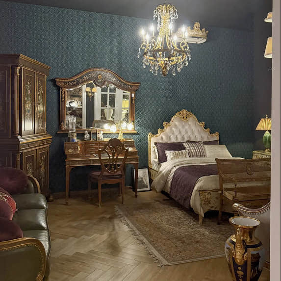 Homedor | Luxurious bedroom |collection with ornate furniture, chandelier, and decorative elements.