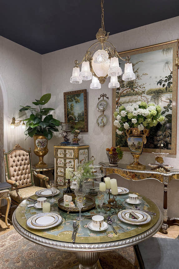 Homedor Elegant dining room with ornate table, chairs, and decorative elements.
