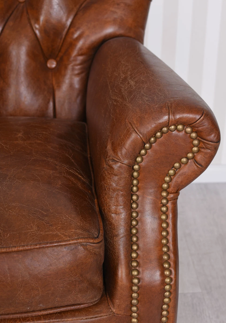 Vintage Brown Tufted Back Leather Armchair with Nailhead Accents and Casters