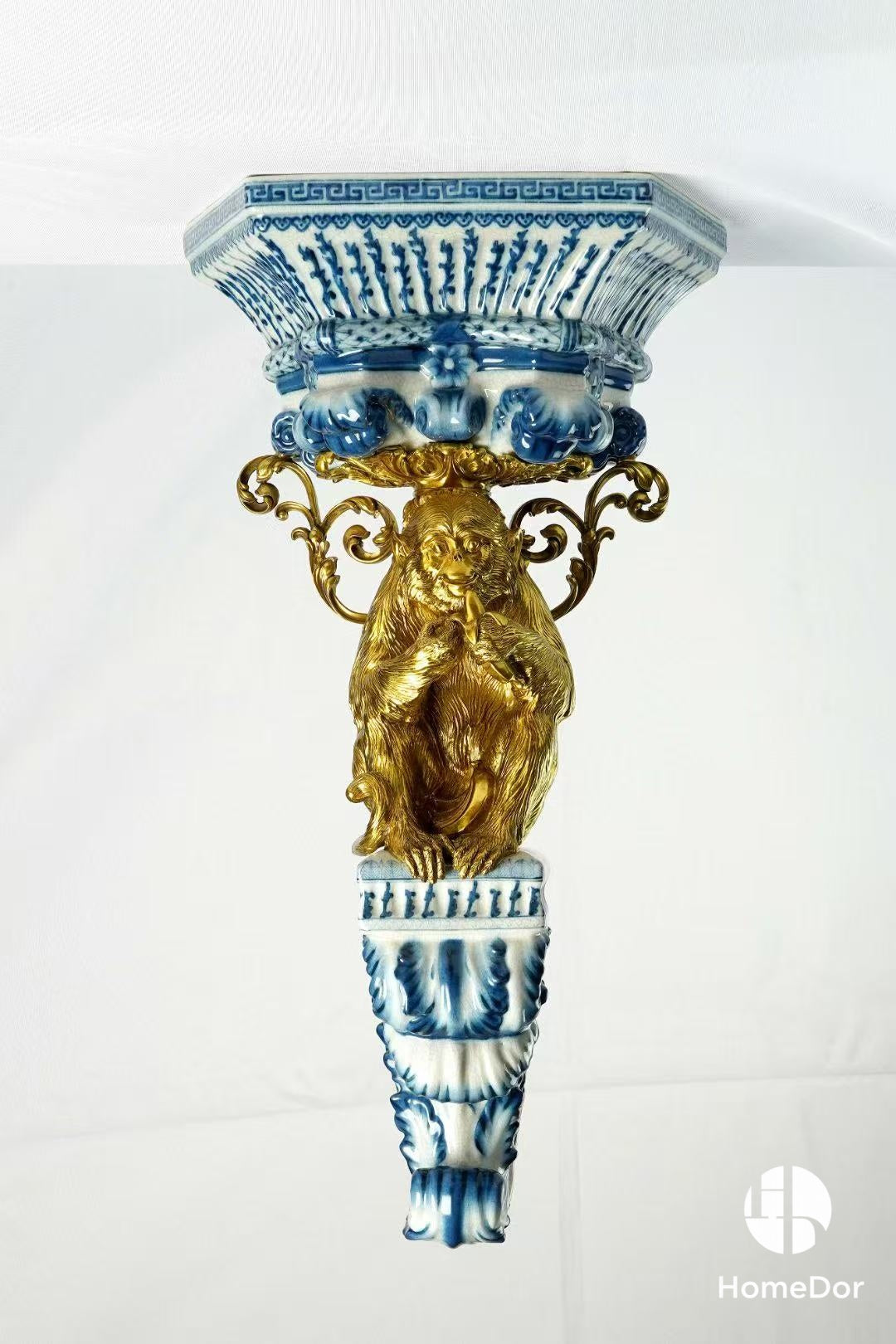 Blue and White Porcelain Wall Decor With Ornate Brass Animal Embellishments
3