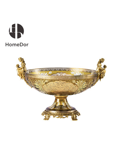 Composed of a monumental amphora, a ceremonial tazza, a grand candlestick, and a covered urn, the collection evokes the atmosphere of a palace treasury where every object is designed to delight the eye and honor the artistry of craftsmanship. Rich amber-gold glass is adorned with intricate gilded patterns, scrolling arabesques, and delicate floral motifs that shimmer with remarkable depth and luminosity.
