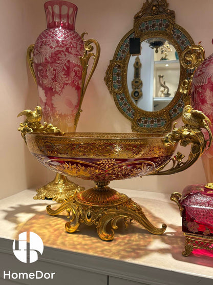 Inspired by the grandeur of Belle Époque interiors and the opulence of imperial collections, the ensemble combines architectural scale with refined craftsmanship. The towering amphora rises as a monumental focal point, while the companion pieces echo its richness through elegant proportions and intricate detailing.