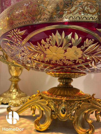 The Aurora Glass Imperial Sunset Ensemble captures the warmth and splendor of a palace illuminated by the final golden light of day.

Comprising a monumental amphora, a decorative amphora, and a grand ceremonial tazza, the ensemble showcases the extraordinary artistry of Aurora Glass through a radiant palette of amber, ruby, and sunlit gold. Delicate floral etching, intricate gilt mounts, and luminous color transitions create a remarkable interplay of light and ornament, transforming each piece into a jewel