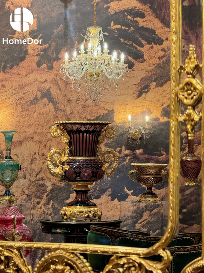 Inspired by the grand decorative traditions of European interiors, its monumental Campana silhouette, richly etched amethyst glass, and sculptural gilded handles create an object that feels both architectural and artistic. Rather than serving merely as a vessel, it commands attention as a focal point—bringing depth, drama, and refinement to the room it inhabits.