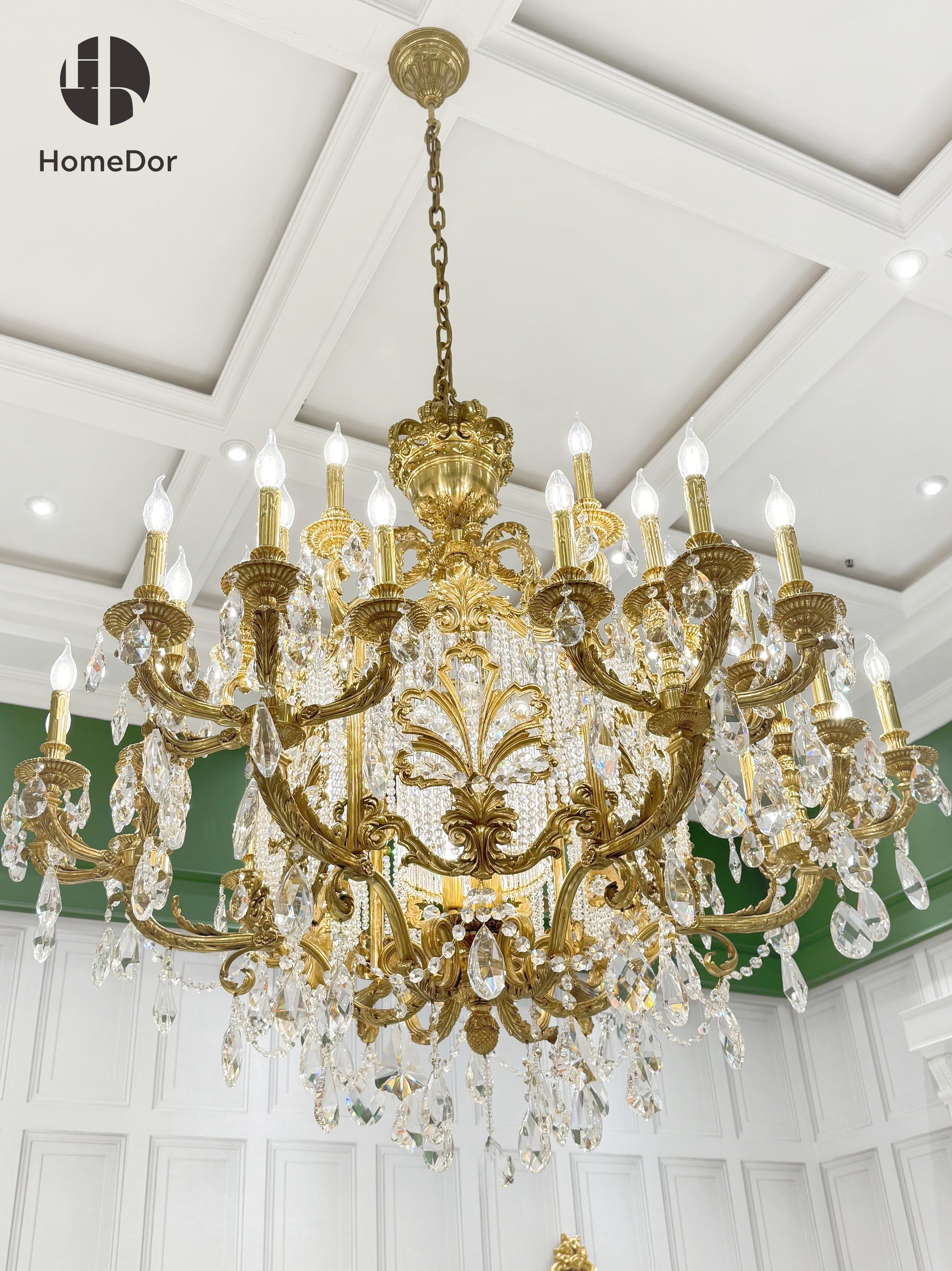 Traditional style luxury brass chandelier in a luxury european style master bedroom.