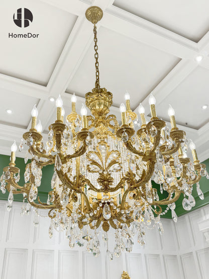 Traditional style luxury brass chandelier in a luxury european style master bedroom.