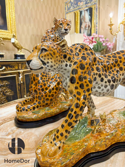 These two sculptures capture the cheetah at its two most distinctive moments. The walking figure moves with the low, fluid authority of an animal that has never needed to hurry.
