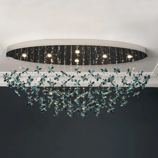 Lampadario in cristallo con fiori di giglio verde acqua