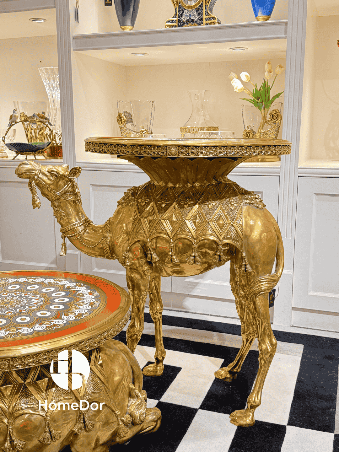 Gold camel-shaped table in a stylish interior setting with decorative elements.