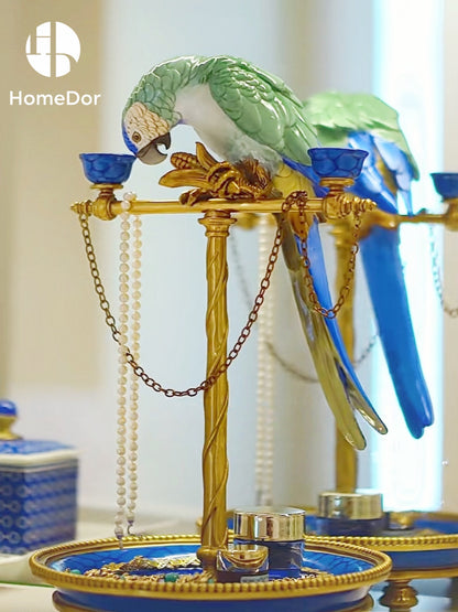 Inspired by the colorful glamour of Palm Beach interiors and the timeless charm of Hollywood Regency design, this Turquoise Parrot Vanity Tray Candelabra combines decorative artistry with everyday function.