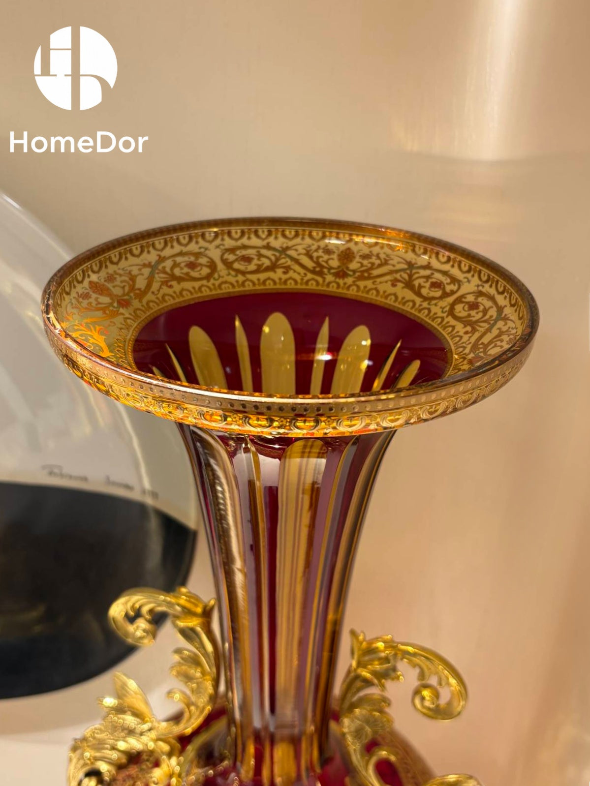 The Aurora Glass Imperial Sunset Ensemble captures the warmth and splendor of a palace illuminated by the final golden light of day.

Comprising a monumental amphora, a decorative amphora, and a grand ceremonial tazza, the ensemble showcases the extraordinary artistry of Aurora Glass through a radiant palette of amber, ruby, and sunlit gold. Delicate floral etching, intricate gilt mounts, and luminous color transitions create a remarkable interplay of light and ornament, transforming each piece into a jewel