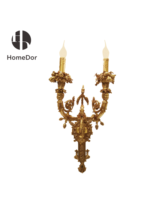 This Baroque Gilded Grape Accent 2-Light Wall Sconce is a wearable work of art, designed to be the focal point of grand entryways, formal dining rooms, or stately hallways, infusing every space with the lavish charm of 17th-century European design. It is also available as a pair for symmetrical, opulent decor.