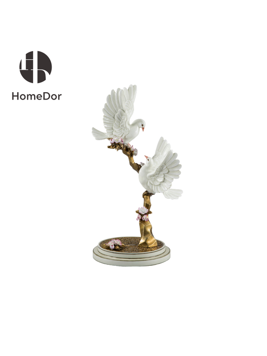 Luxury tabletop decor piece with ornate brass base and ceramic dove figurines.