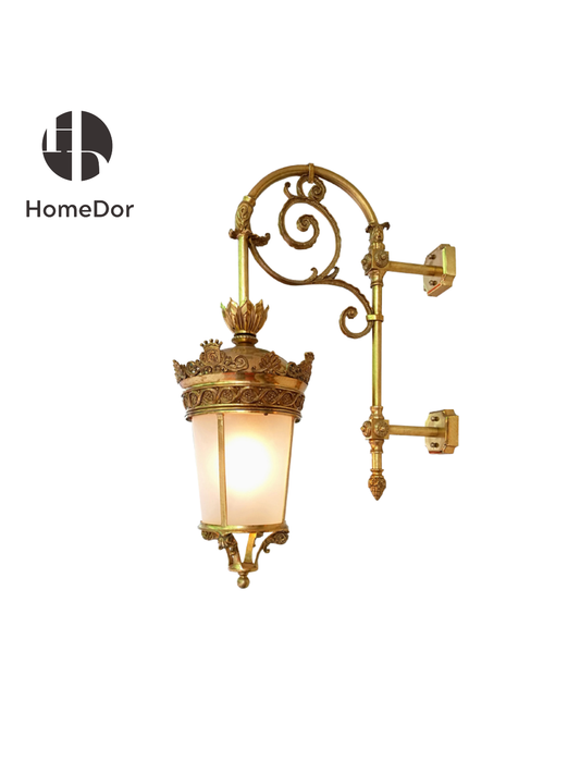 This wall lamp is ideal for framing entryways, illuminating verandas, or adding a touch of château-inspired luxury to any sophisticated space.