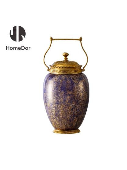 Comprising two monumental covered urns and a coordinating tea caddy, the ensemble transforms porcelain into a vision of carved amethyst, enriched with gilded ormolu-style mounts and sculptural detailing. The richly speckled surface evokes the depth of natural stone, creating the illusion of mineral formations polished over centuries and adorned for a palace collection.