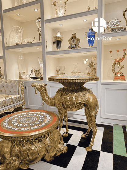 Decorative camel-shaped table in a showroom setting with 'HomeDor' branding.