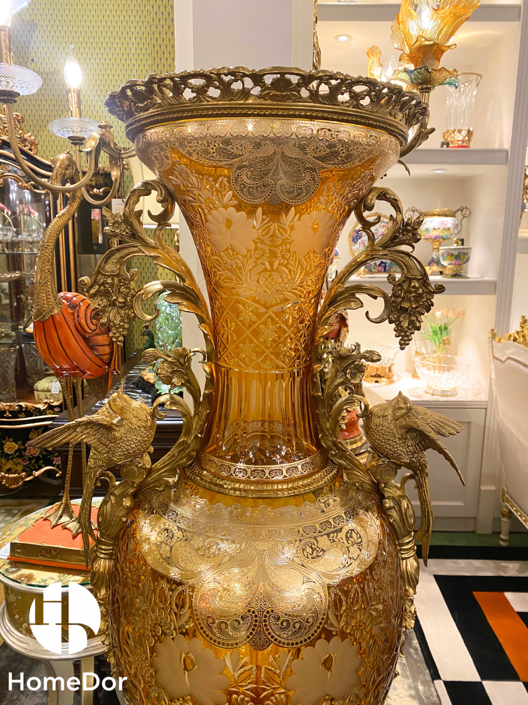 Featuring intricate Arabesque-inspired etching and sculptural bird guardians.