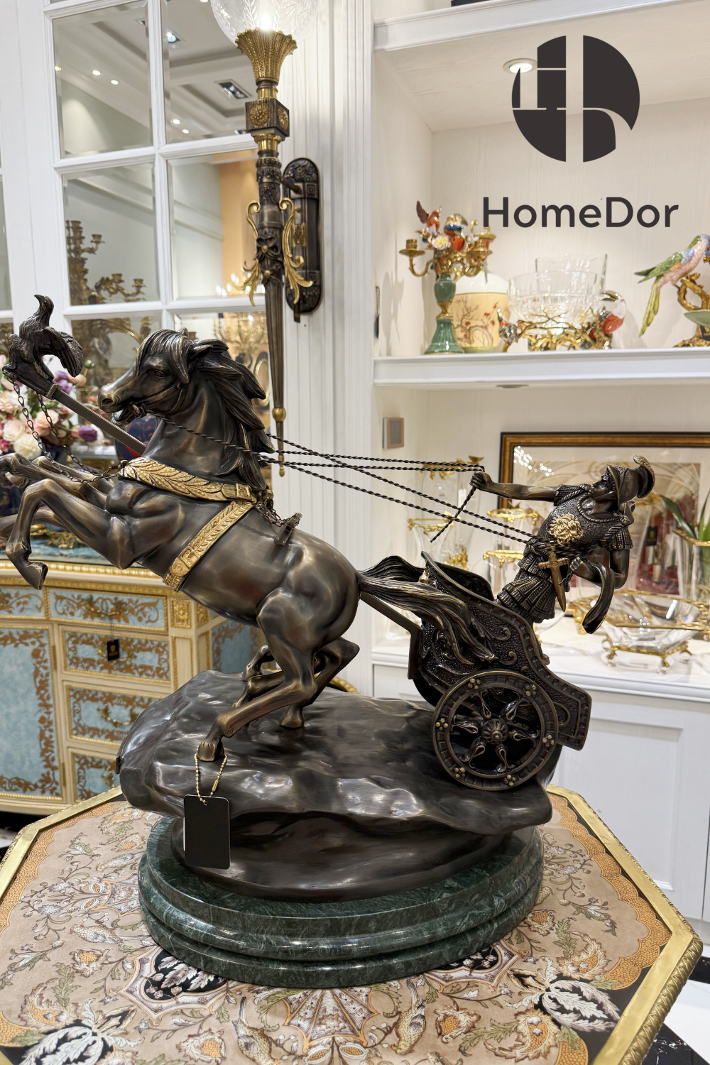 Two horses rear mid-stride, reins pulled taut as a helmeted charioteer leans into the motion behind them.