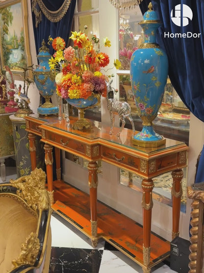 Consola larga Serenity Chinoiserie HomeDor con dijes en naranja dorado
