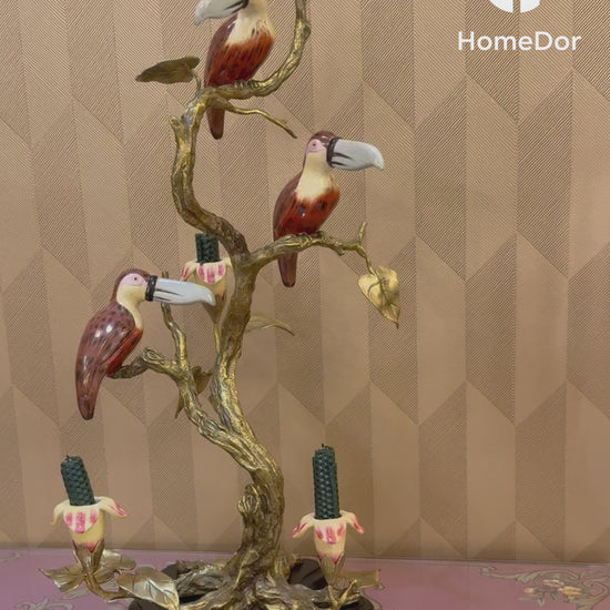 Decorative figurine featuring nature-inspired carving and brass finish.
