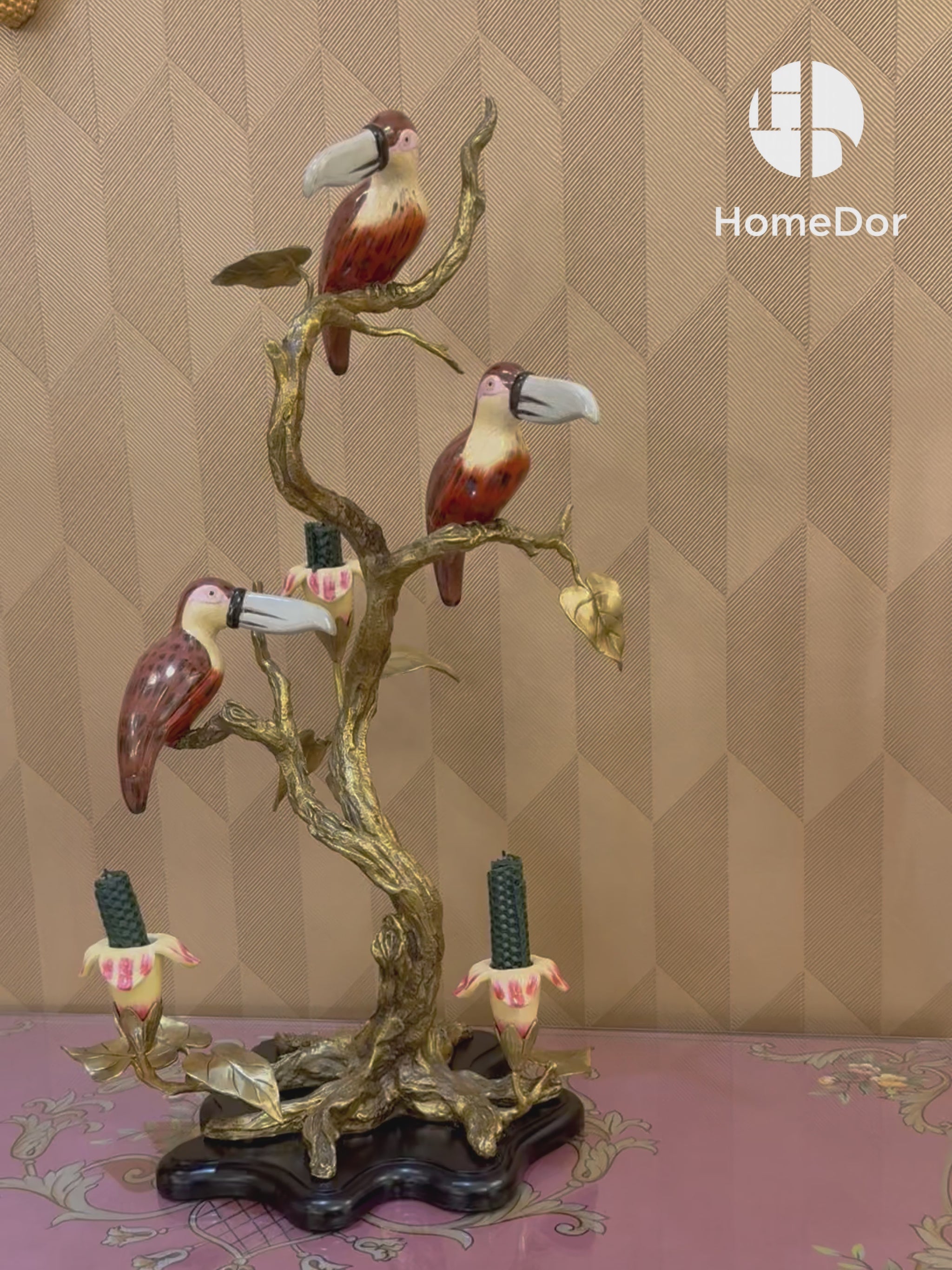 Decorative figurine featuring nature-inspired carving and brass finish.