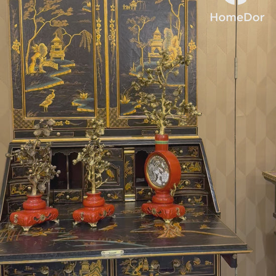 This Exquisite Black Lacquer Secretary Bookcase with Gold Oriental Scenes is a captivating and refined addition to the HomeDor collection. It combines the classic allure of a birch wood structure, the unique texture of carbonized poplar panels, the versatility of MDF, and the delicate charm of resin accessories, all brought to life with luxurious gold-oriental scenes on a black lacquer finish, resulting in a piece that radiates timeless elegance and sophisticated artistry.