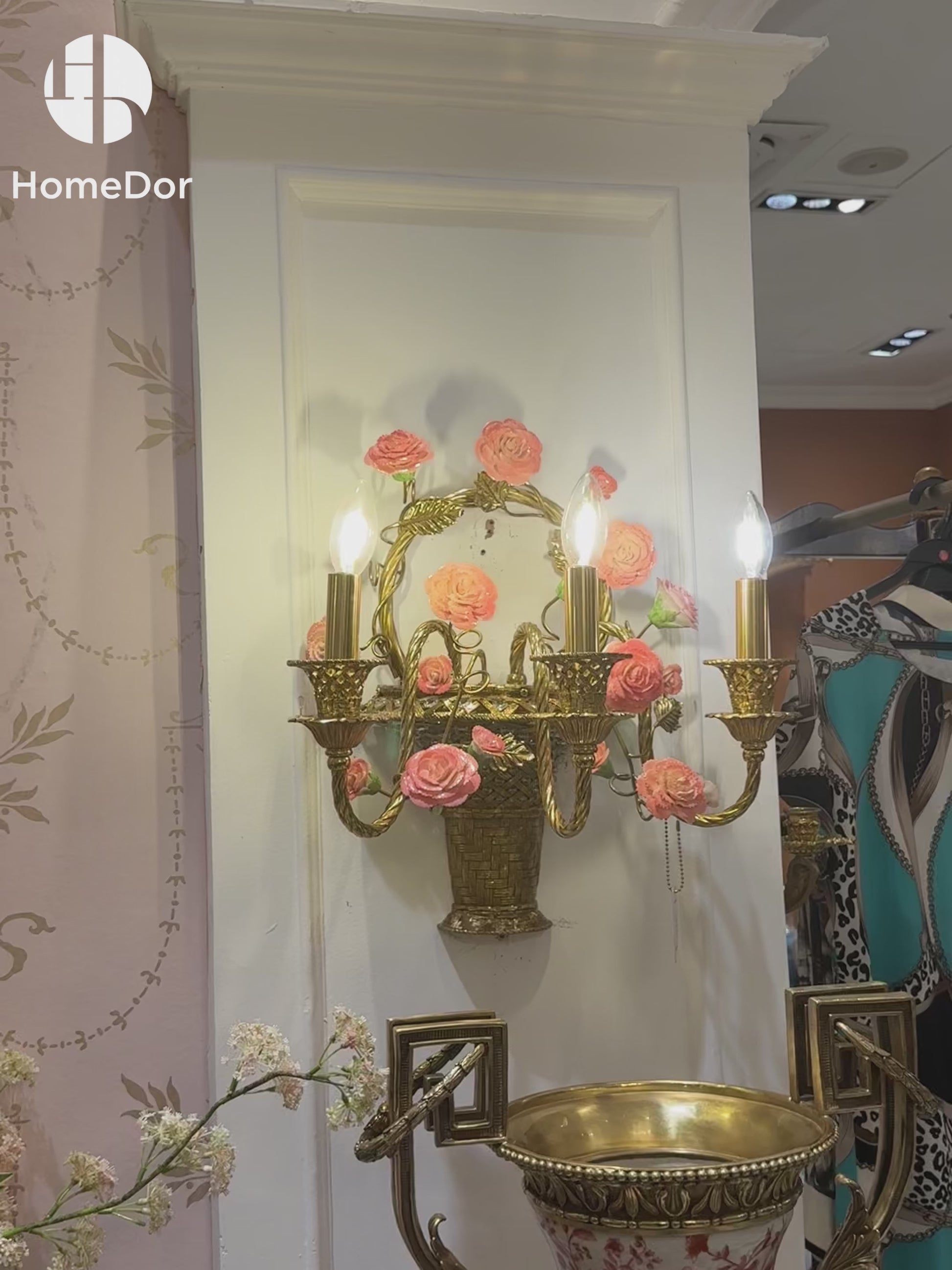 This beautiful pink floral brass wall sconce is rooted in New Spanish aesthetic influences, it acts as both a functional light source and a decorative focal point. Perfect for spaces leaning into rustic romance, classic vintage, or Mediterranean-inspired styles, this sconce turns empty walls into captivating, inviting features.