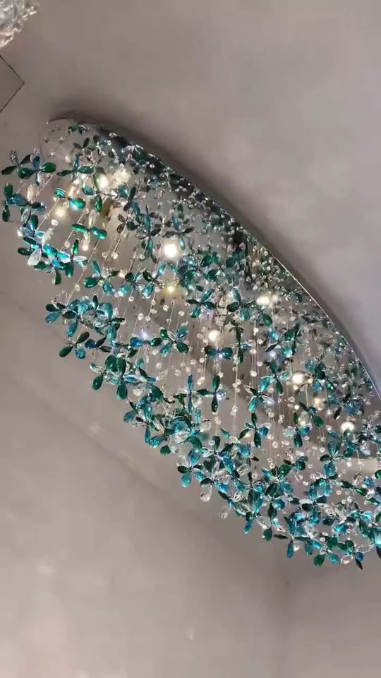 Lampadario in cristallo con fiori di giglio verde acqua